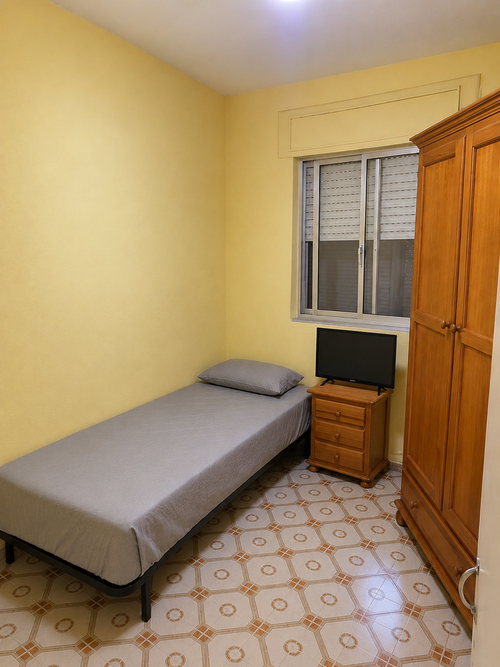 Habitación confortable para una persona bien amueblada 